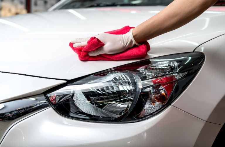 Hand of a man cleaning a car